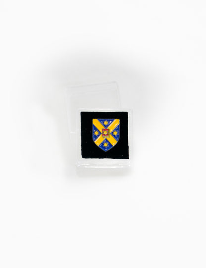 Crest lapel badge